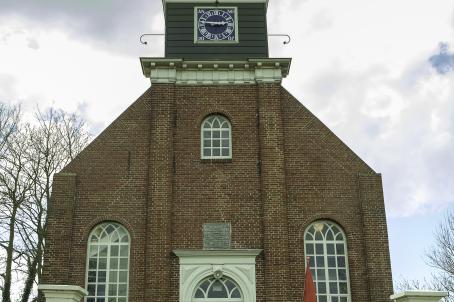 Brick church with pointed roof turret