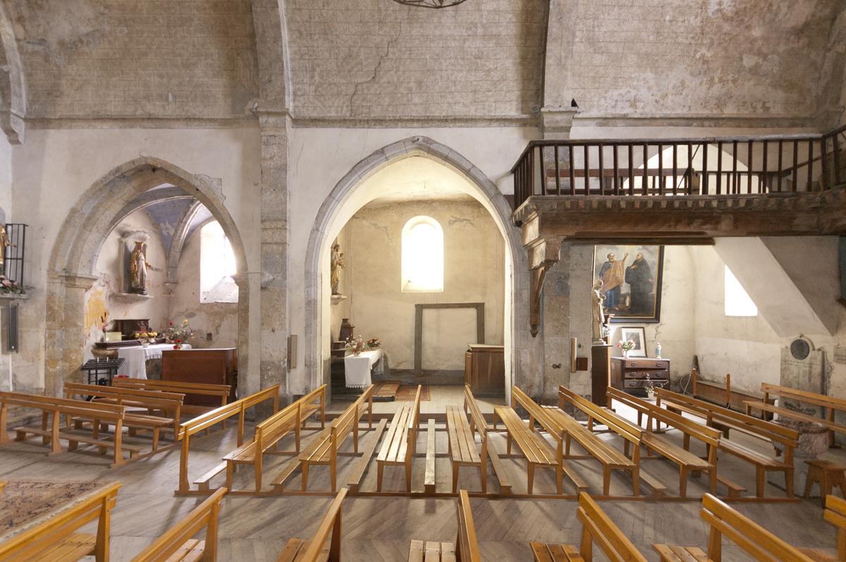Church interior with arches and artefacts 
