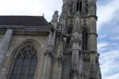 Bell tower of a church decorated with spires and pinnacles