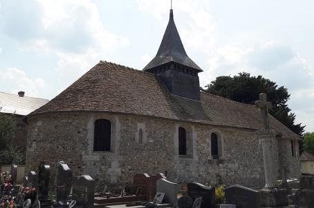 Small church with a pinnacle in a graveyard