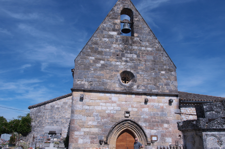 Church wall-tower decorated with a round dormer