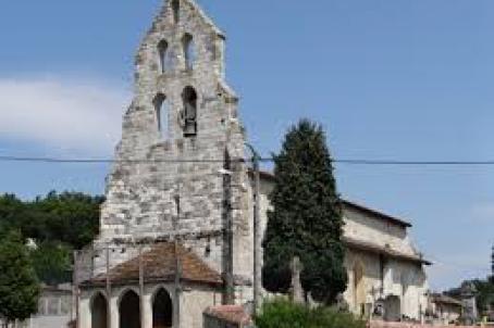 Foreground of a church wall-tower decorated with four bell-gables