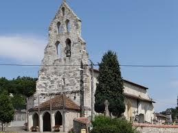 Foreground of a church wall-tower decorated with four bell-gables