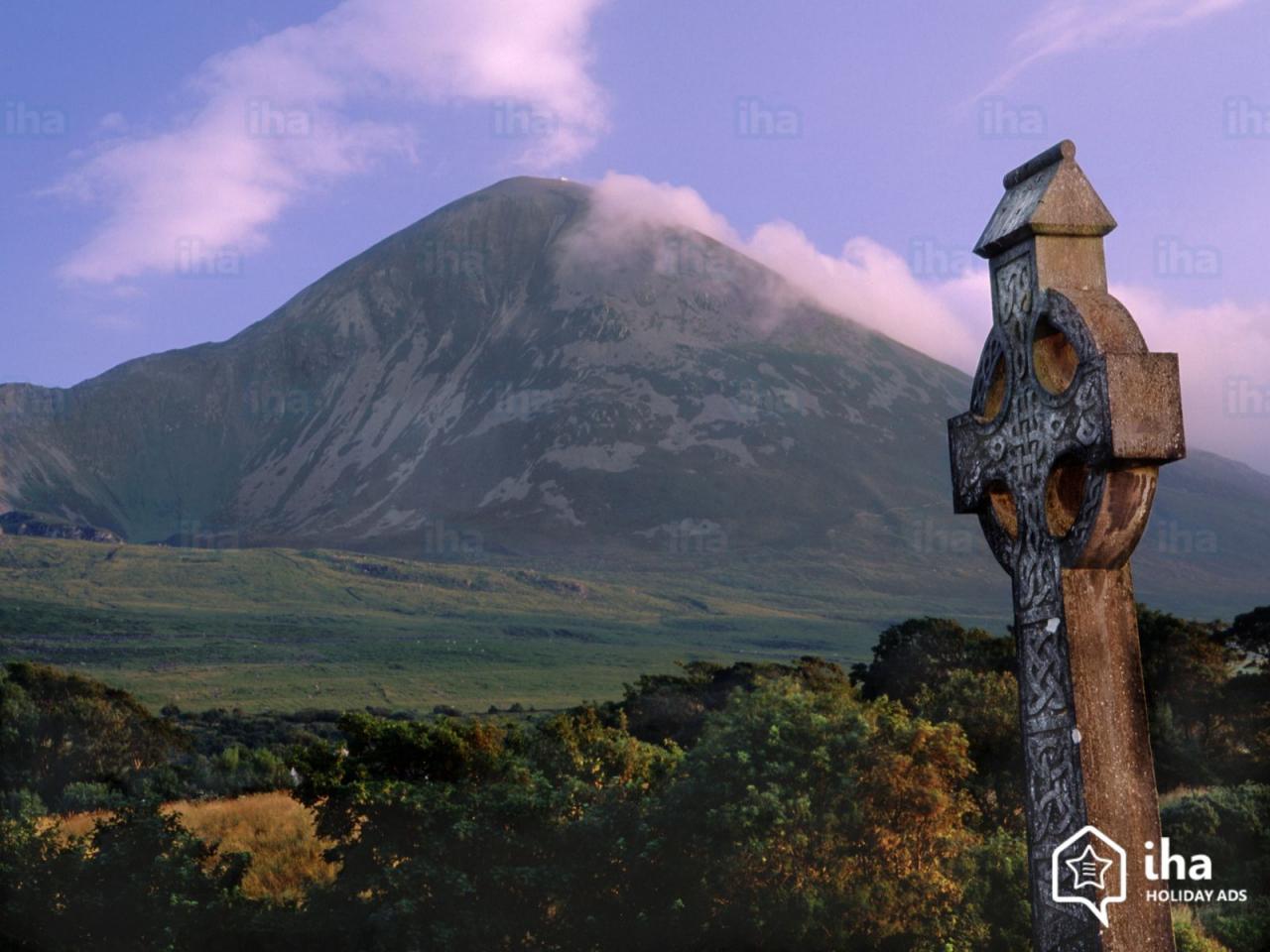 Pick of the Sacred behind a tombstone